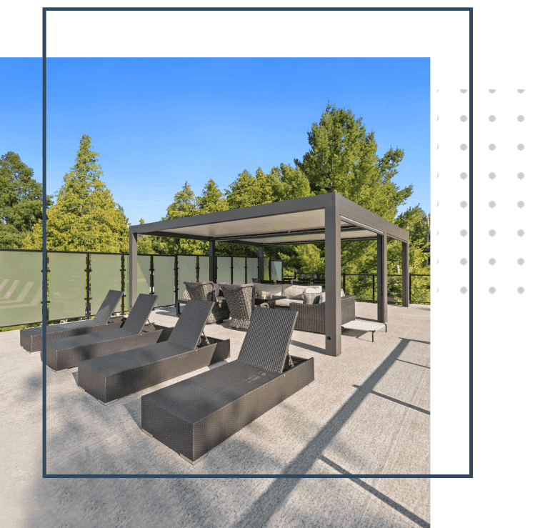 A rendering of an outdoor lounge area with chairs and a gazebo.