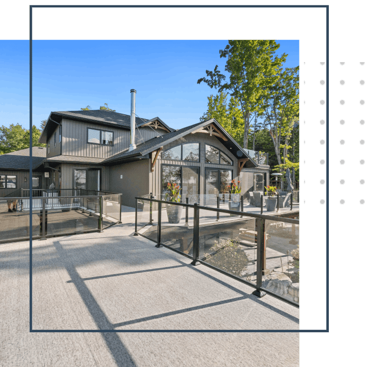 A Henley Contracting additions picture of a house with a fence around it.