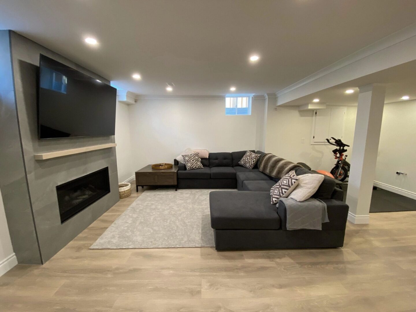 A living room with a couch and fireplace