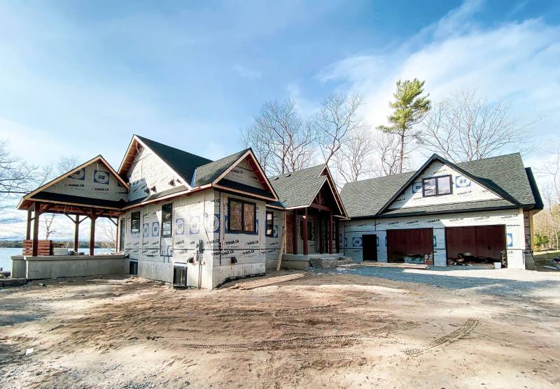A house in the portfolio that is being built in the dirt.